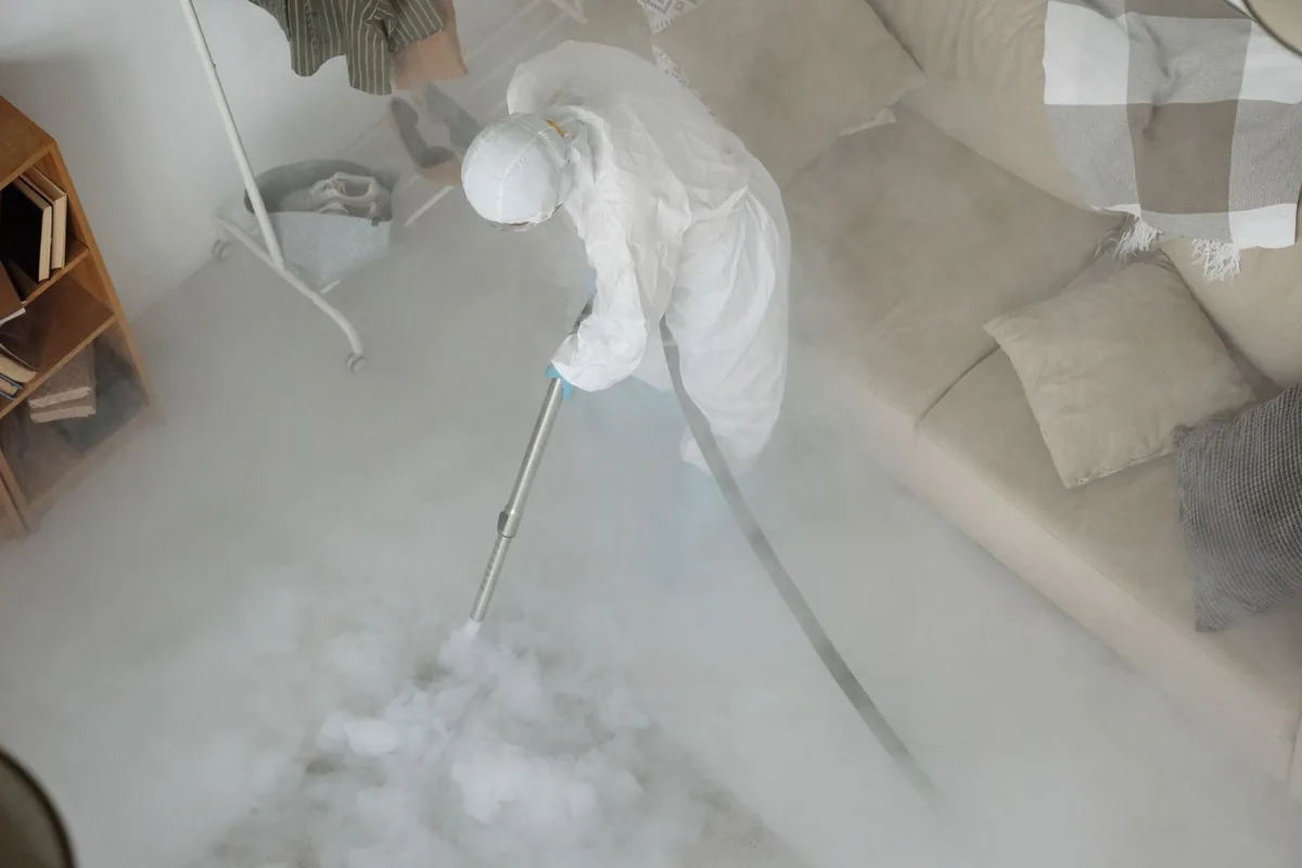 Biohazard cleanup technician in protective equipment, Vienna, GA
